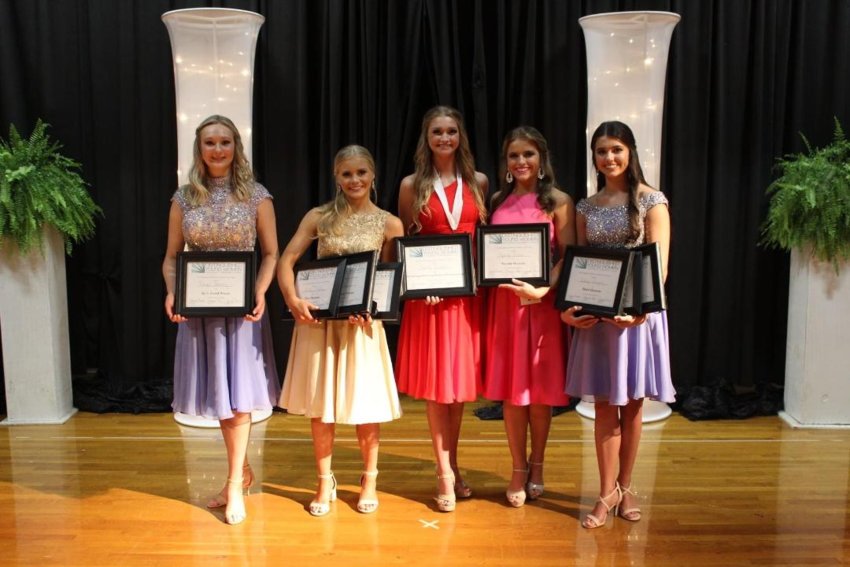 Faith Shumaker, third from left, was  named 2022 Distinguished Young Woman of Neshoba County Saturday during the annual program. She is pictured with award winners, from left, Laurel Brantley (Spirit Award), Mallory Chunn (Overall Fitness Award, Talent Award, and 1st Alternate), Faith Shumaker (DYW of Neshoba County 2022), Sydney Sisson (2nd Alternate), and Carlyn Vaughn (Scholastic Award, Self-Expression Award, and 3rd Alternate). 